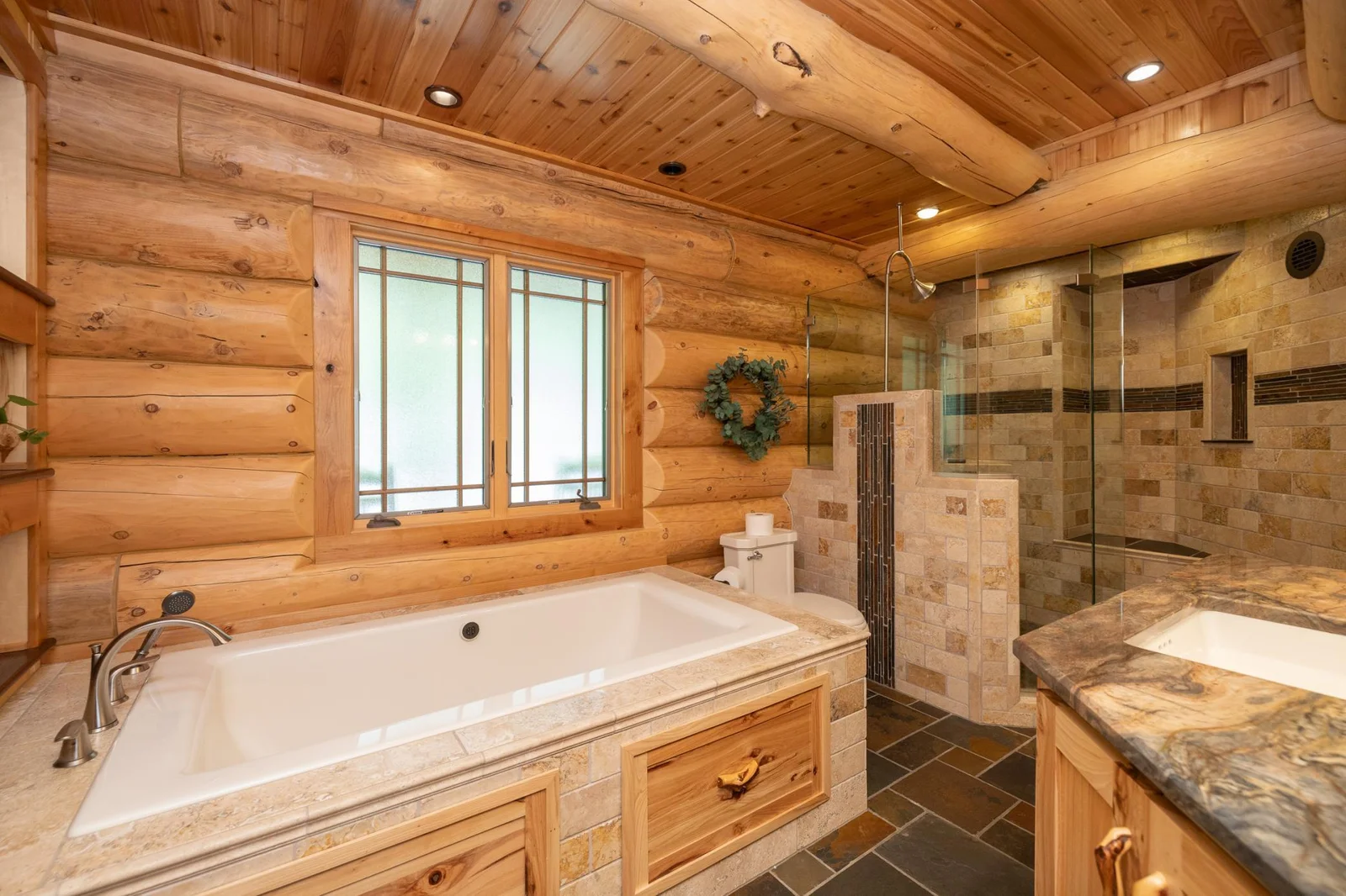 Oversized jetted tub with separate shower in primary bath