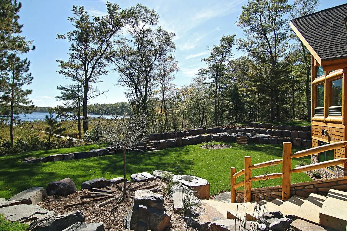 View from the garage side of the home looking at the front yard and lake
