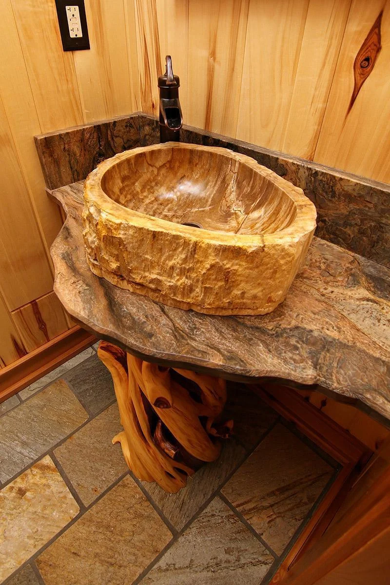 Main floor bath features petrified wood sink