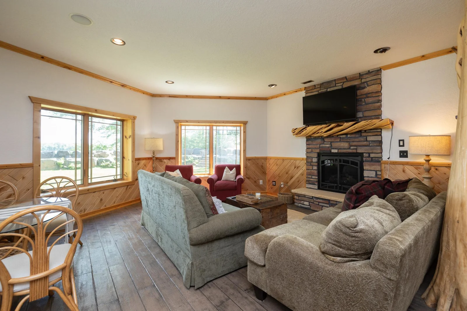 lower level family room with gas fireplace and views of the lake