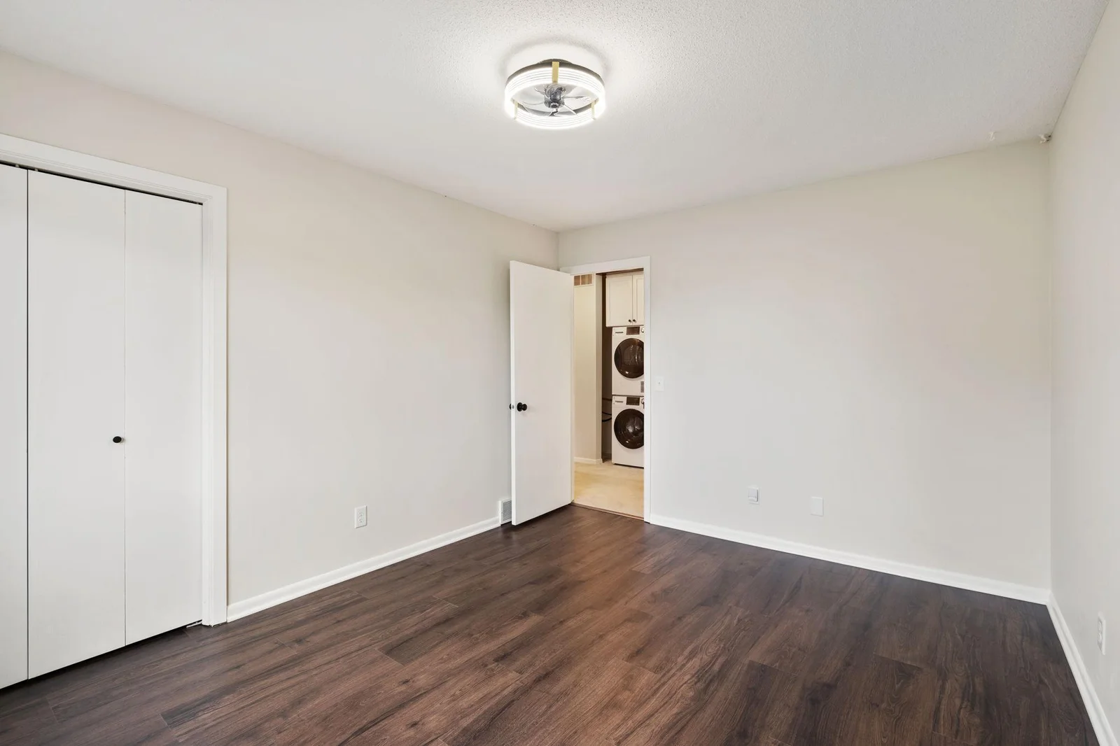 The second bedroom is quite large and offers perfect proximity to both the full bathroom and the laundry nook.