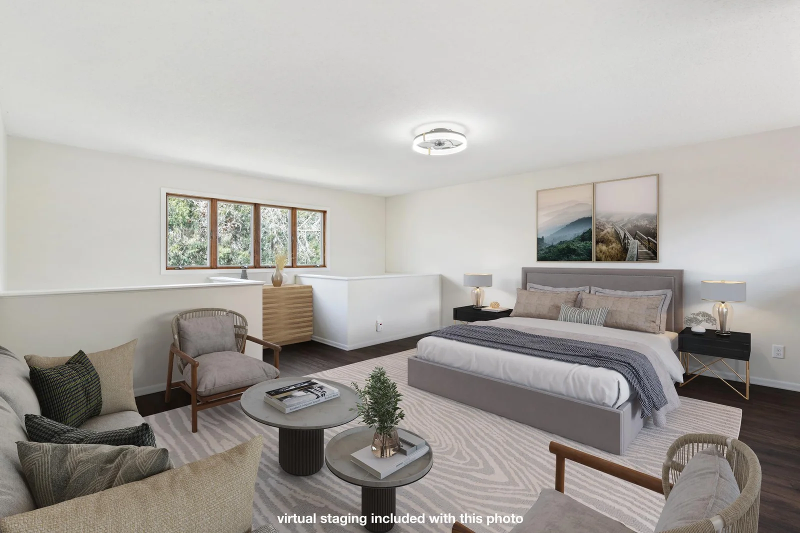 Primary bedroom is massive and features open areas for seating. *photo includes virtual staging for reference.