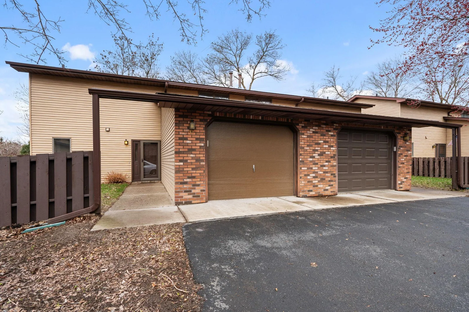 A new garage door welcomes you home, and the fenced courtyard provides a bit of privacy.