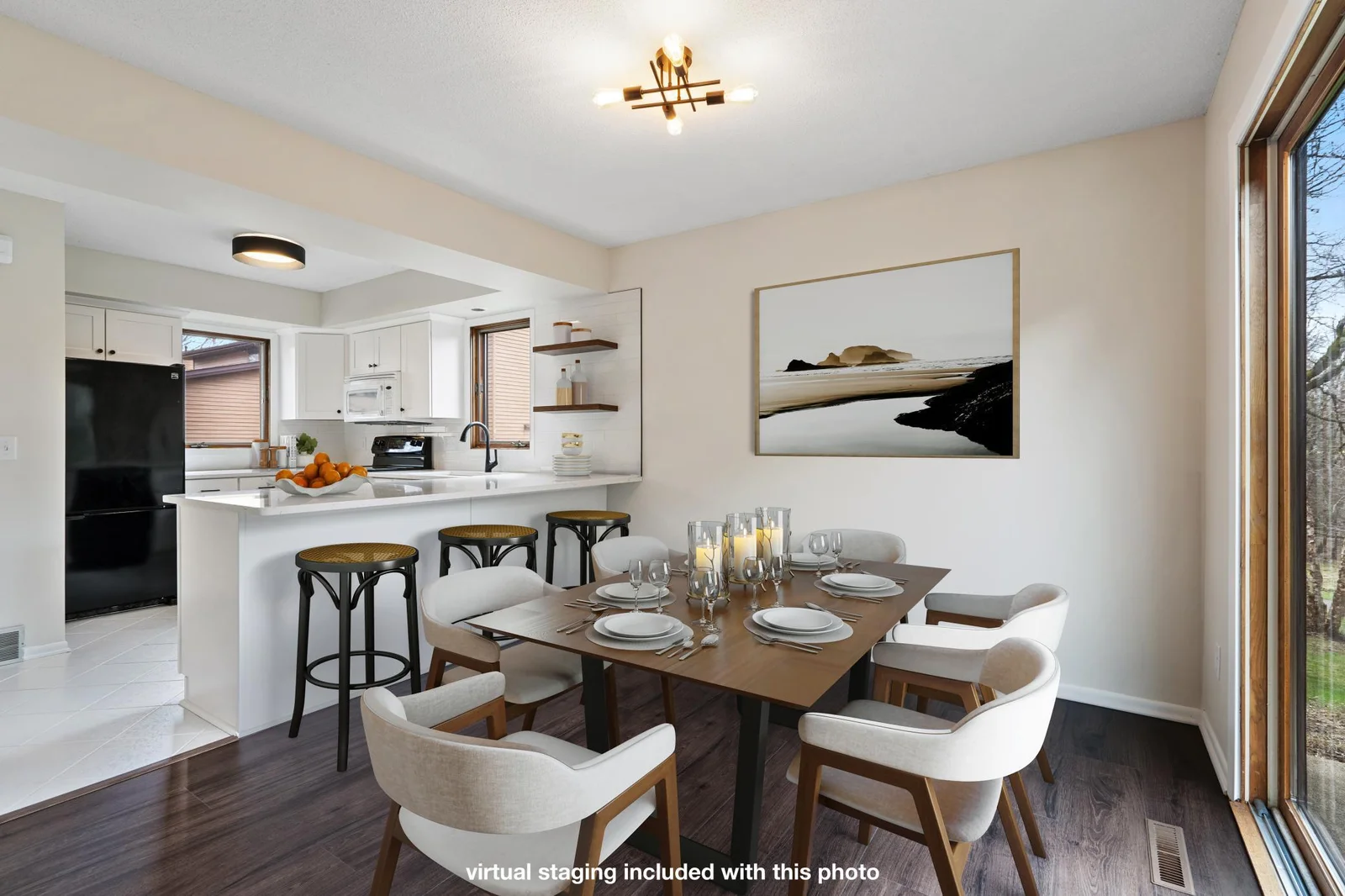 Dining room flows perfectly from the kitchen for ease of entertaining and serving.  The breakfast bar is the perfect workstation or meal place.  *photo includes virtual staging for reference.