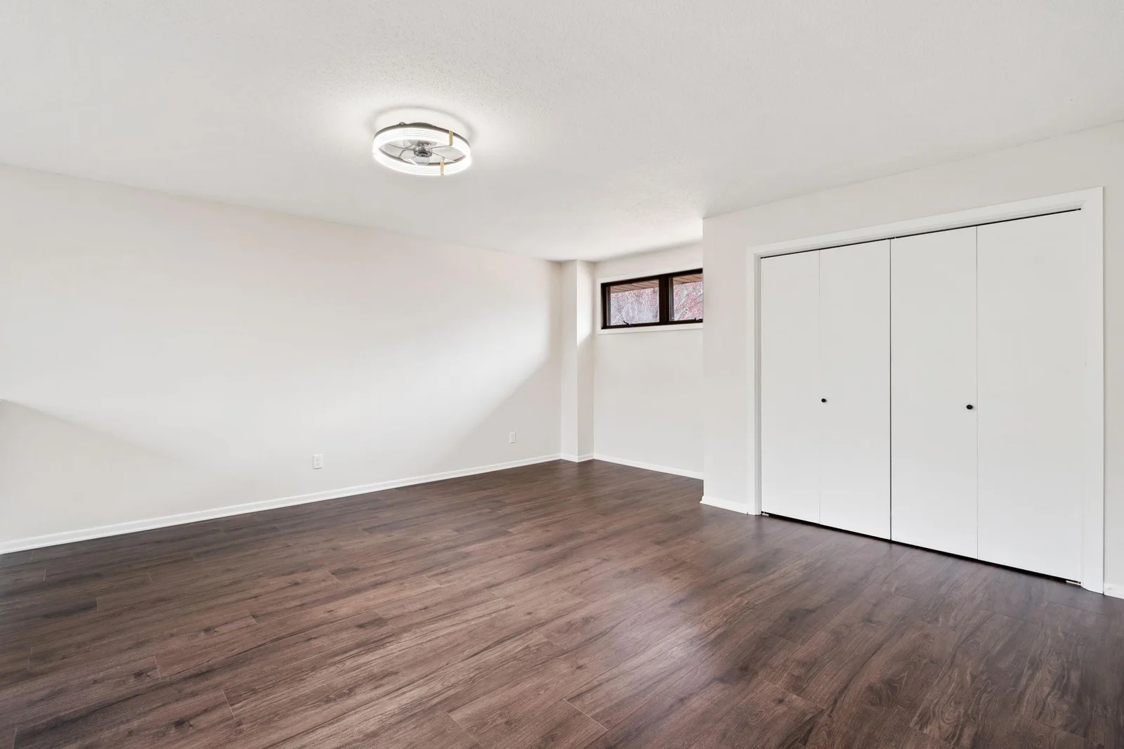 Alternative view of primary bedroom, showcasing another nook and the large closet.