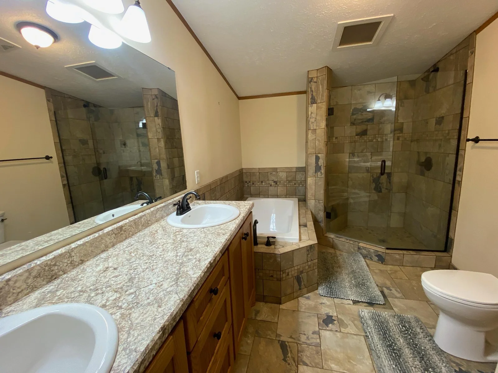 Recently remodeled Primary Bathroom with Tub and Shower Separates and Dual Sink Vanity.