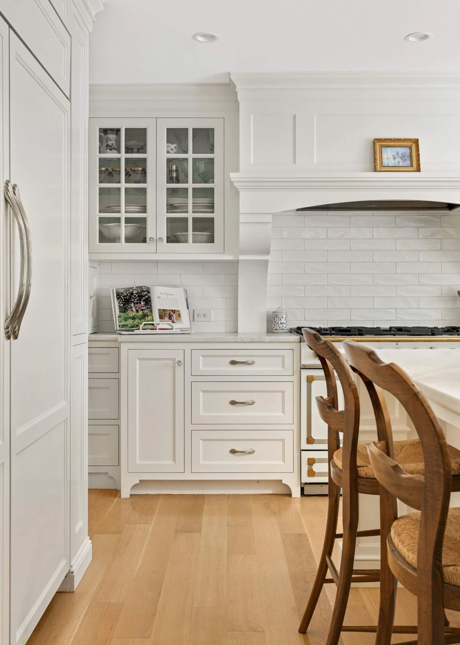 Gorgeous, custom vent hood is one of the focal points in this kitchen -- one from every angle.