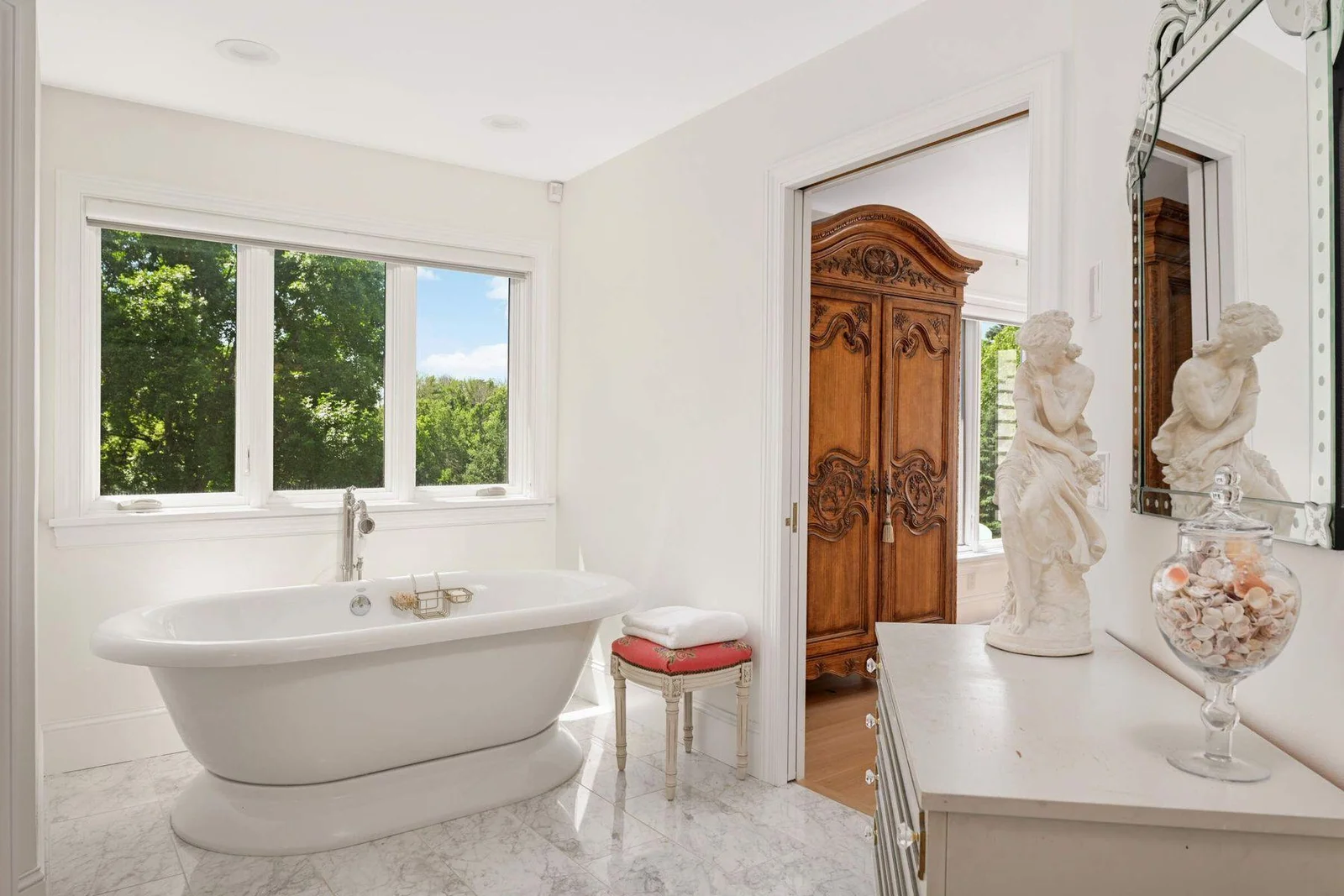 The soaking tub is positioned under the large window with extremely private views!