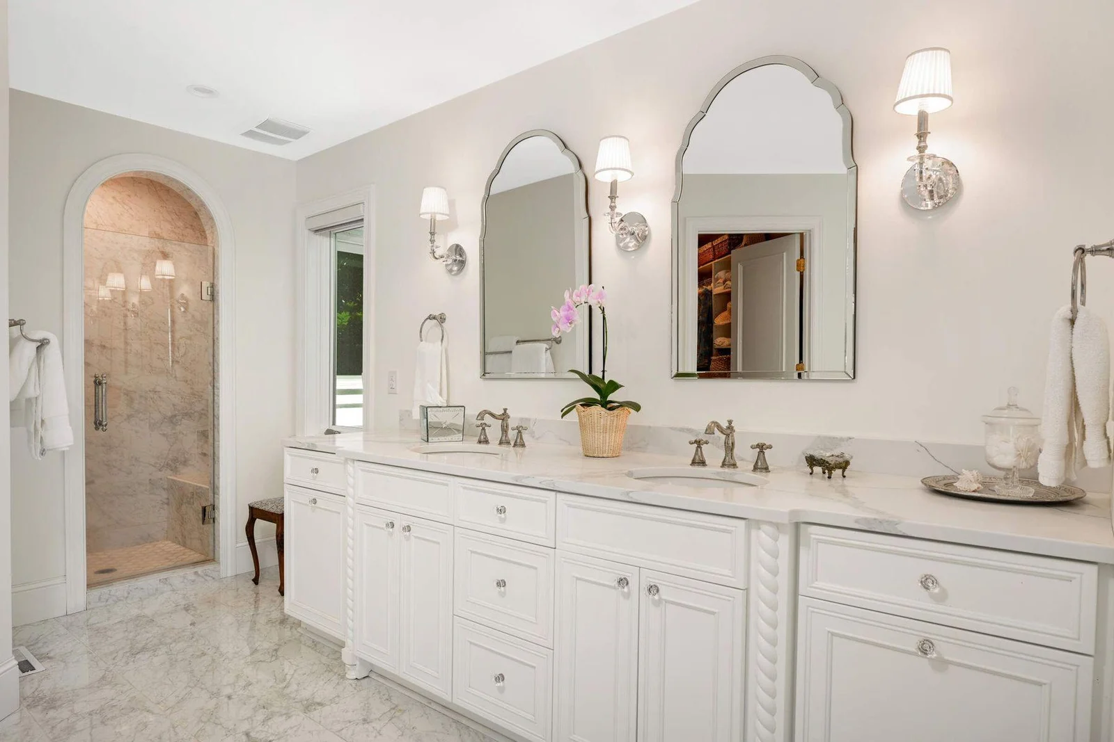 The marble cased shower took great skill, care and multiple weeks to construct in the signature arch,