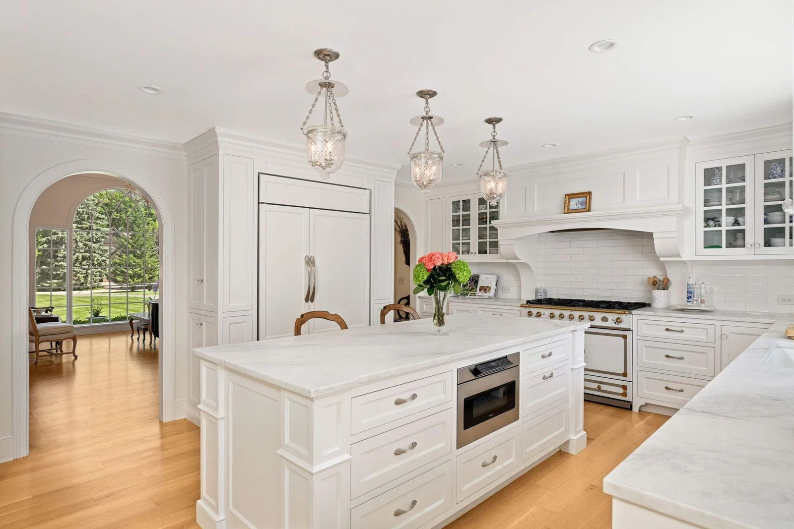 The Subzero refrigerator is flanked by two pantries on either side, exceptionally designed to be European and less "suburban".