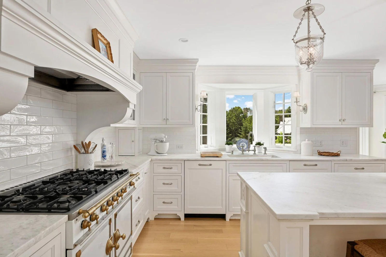 The sink overlooks the private backyard, and has extra depth of countertop for herbs, florals or produce.