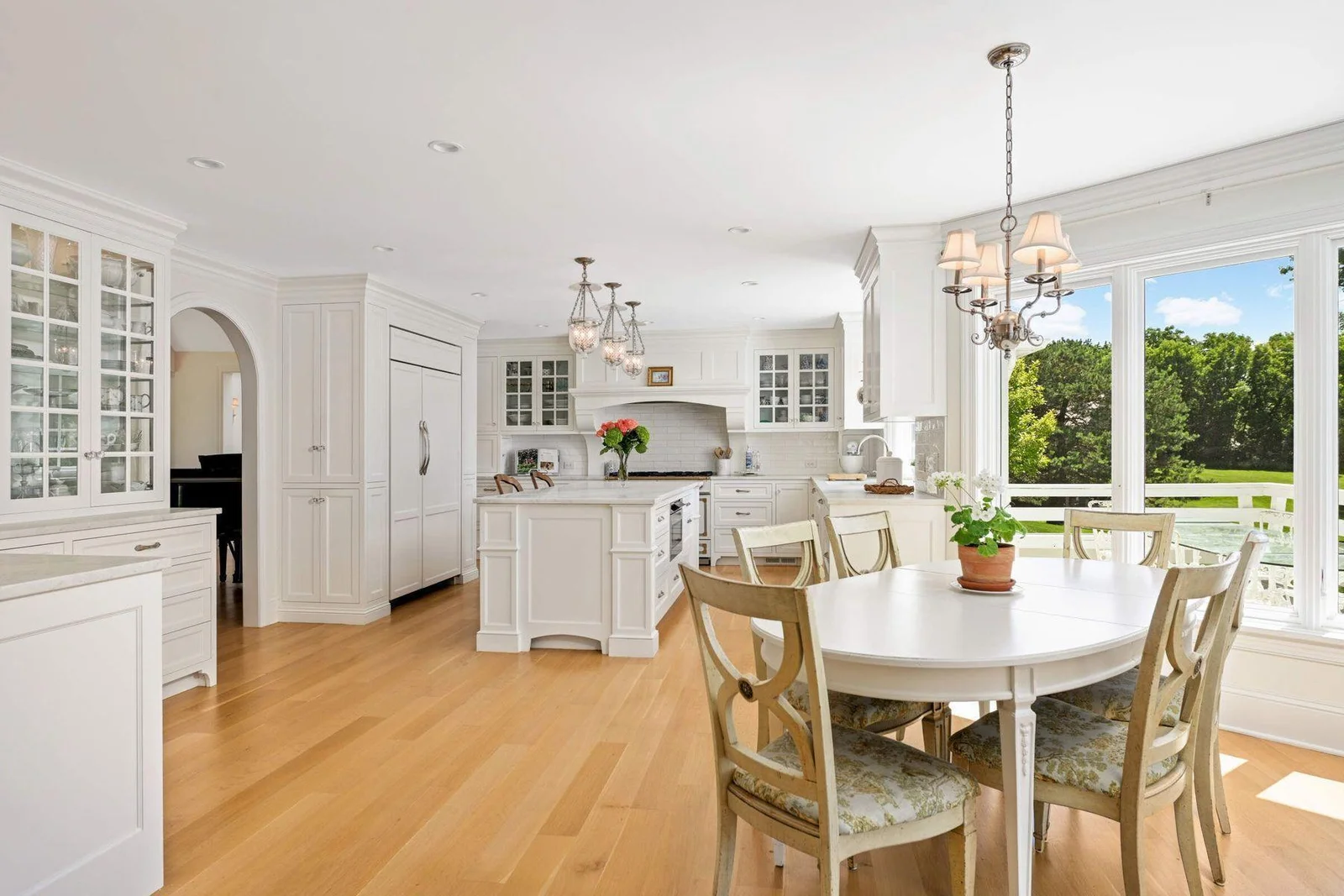 The eat in area is well connected to the kitchen, but comfortably seats six, overlooking the wooded grounds.