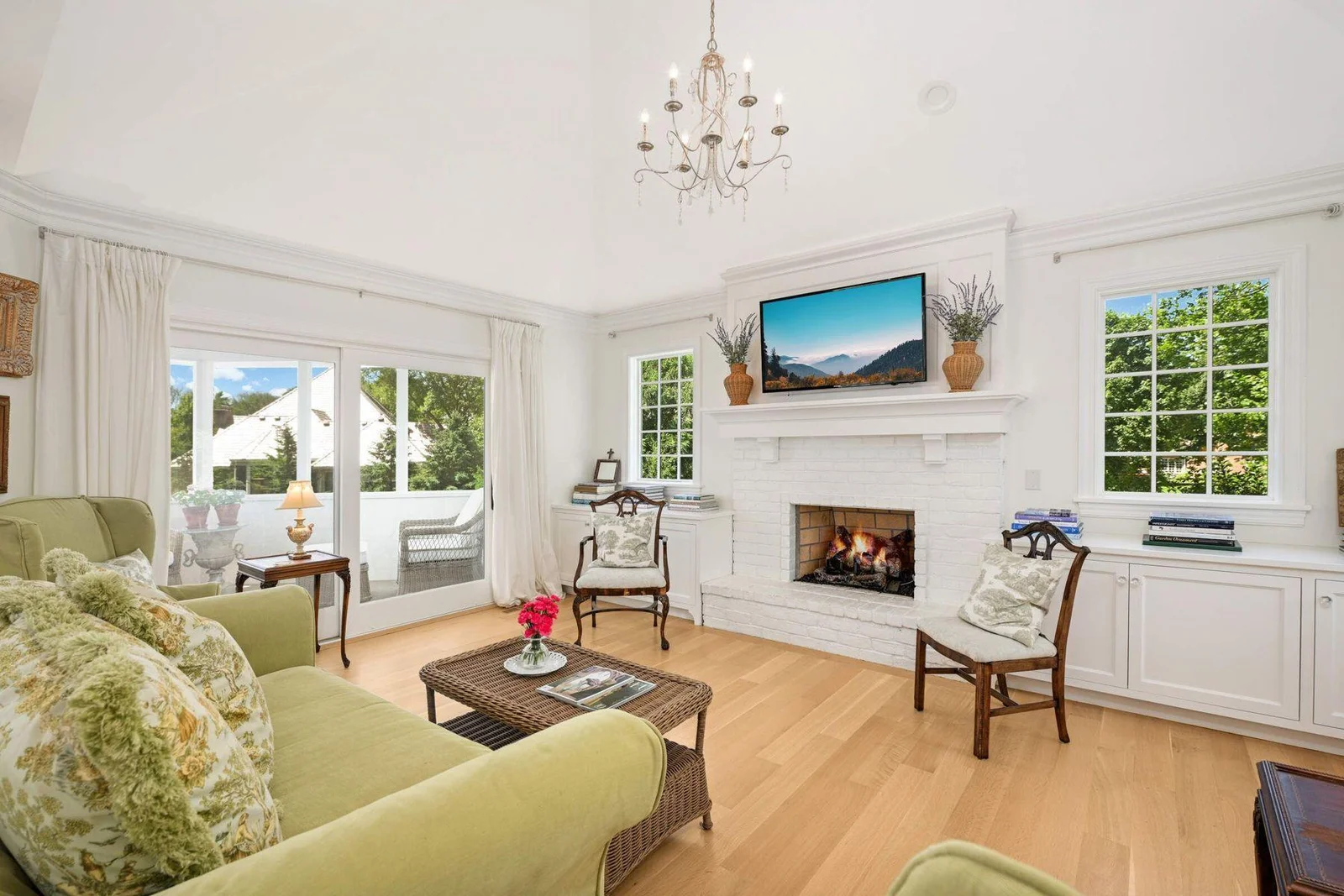 The family room has a gas fireplace, and also provides access to the porch, as well as lots of light from the sliding doors.