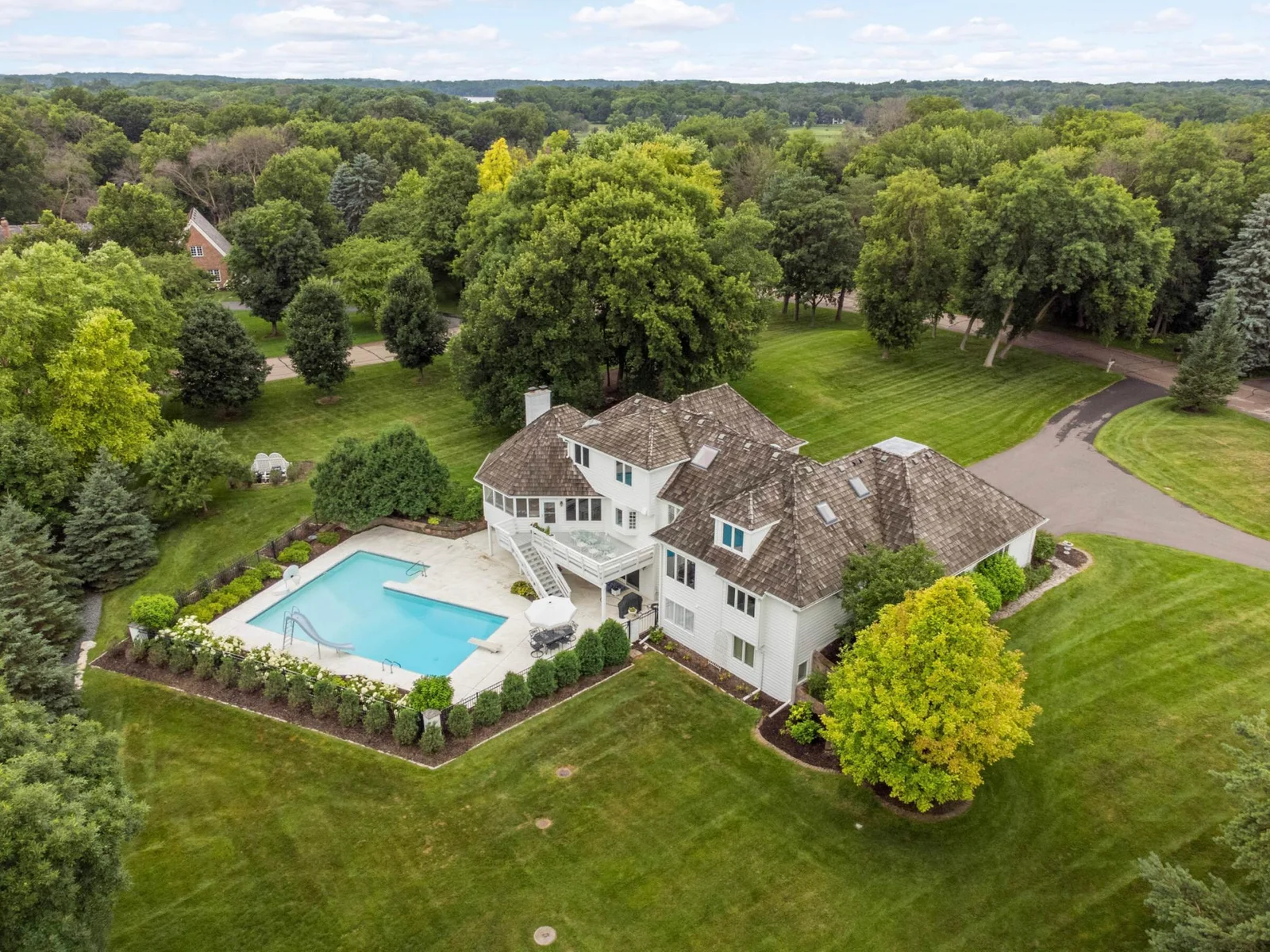 Established trees, circular driveway and in addition to the nearly 2 acres of property, the association owns additional acreage creating even more buffer within the neighborhood.