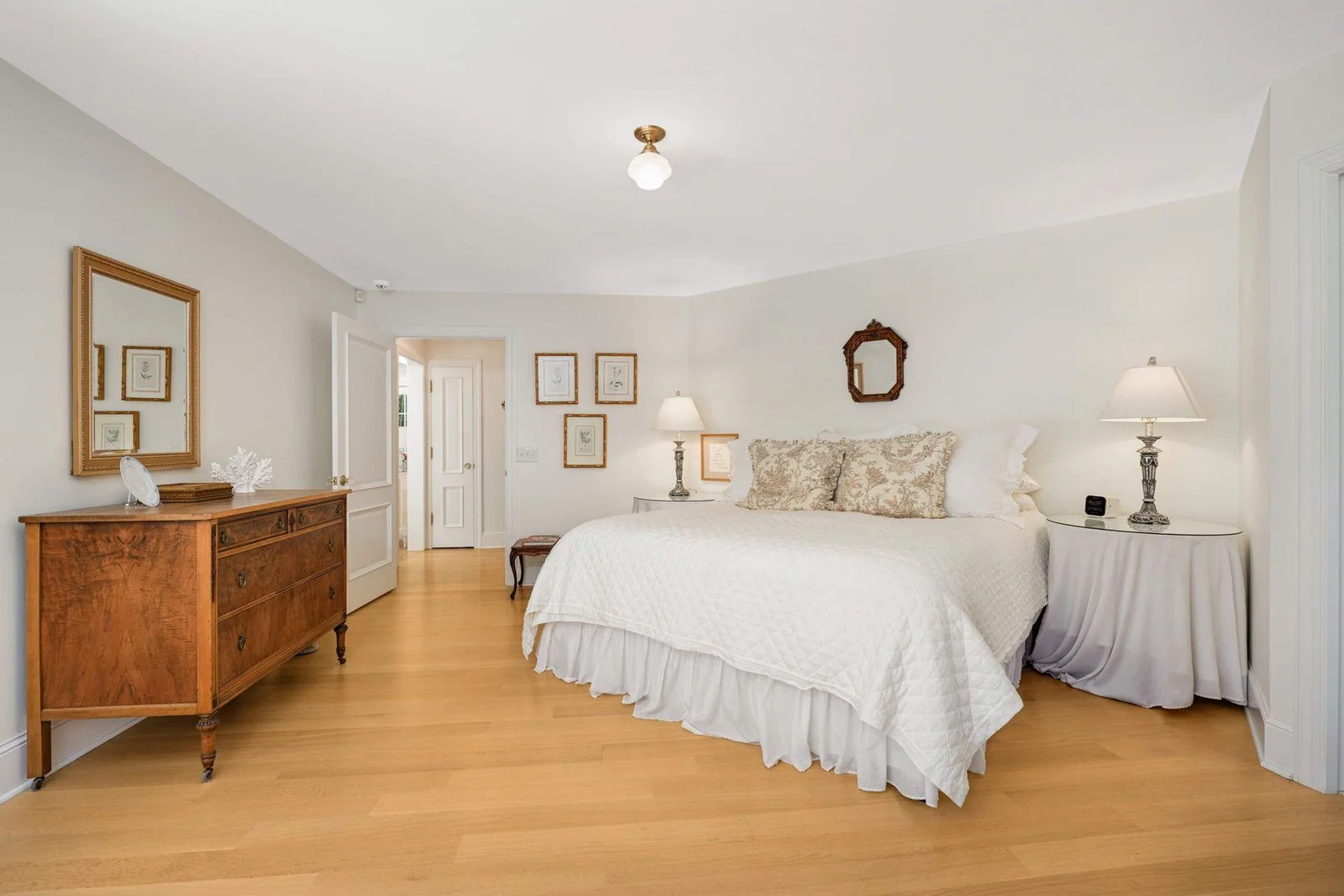 The main floor bedroom has corner windows that overlook the backyard, southern facing exposure.