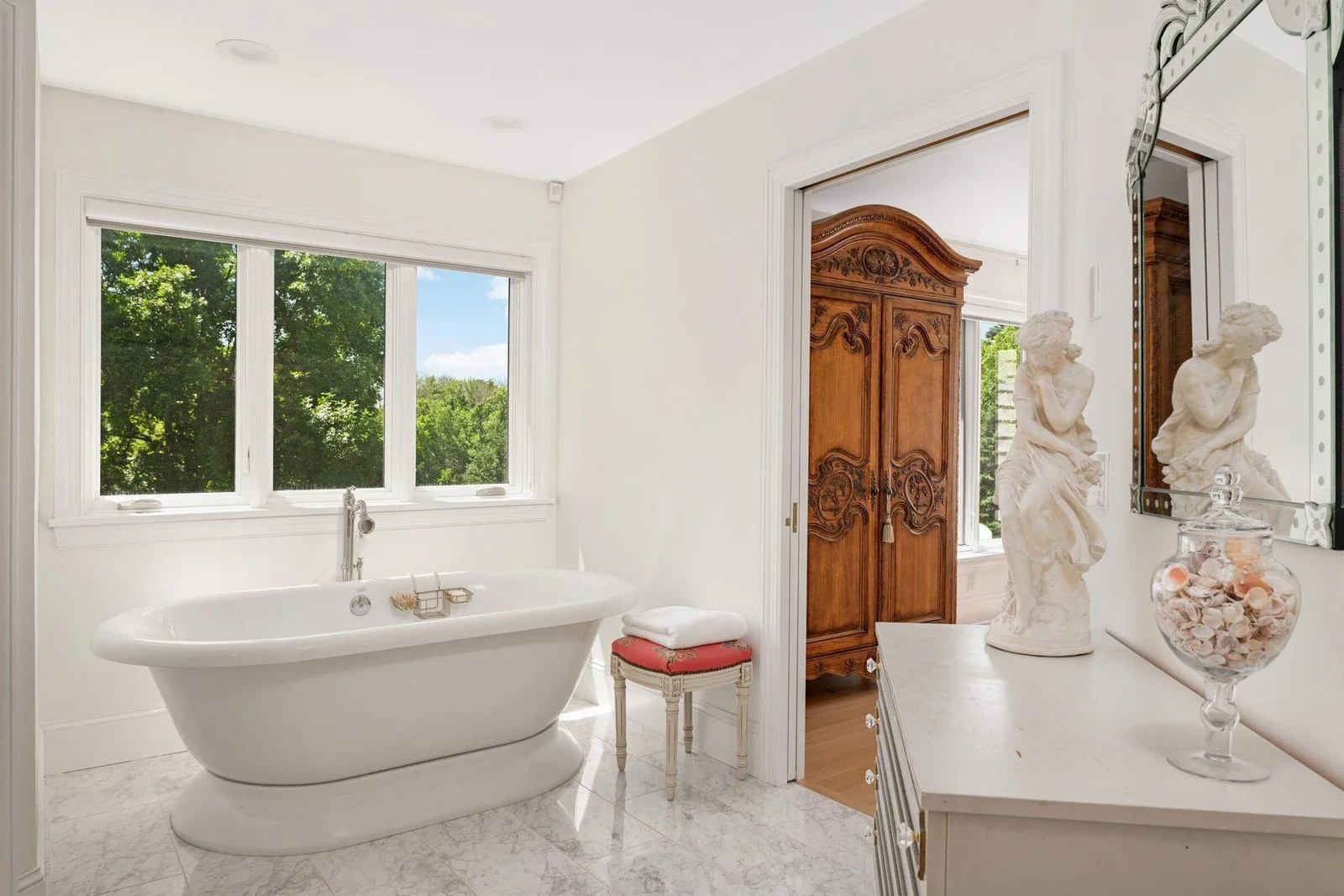 The soaking tub is positioned under the large window with extremely private views!