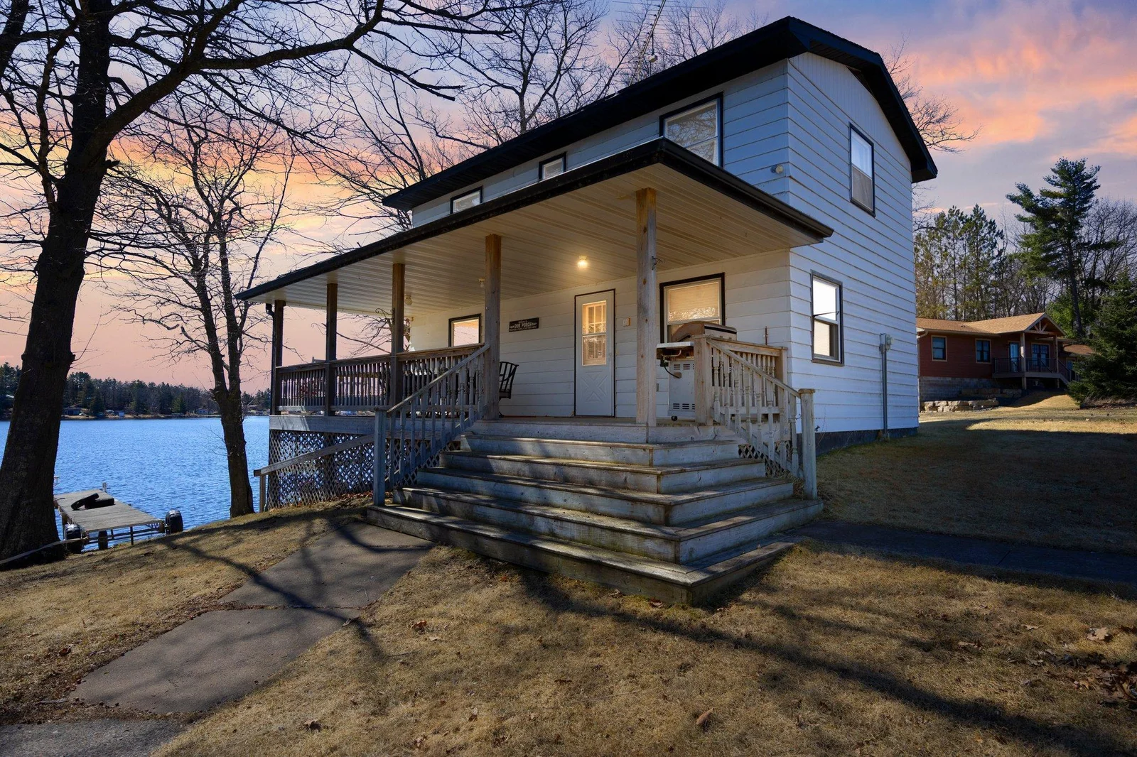 Inviting front porch to spend your evenings overlooking Big Pine Lake
