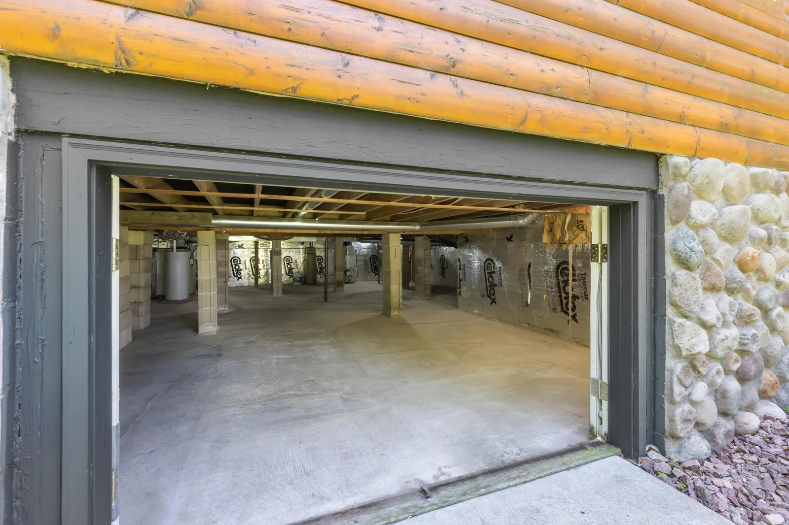 Ample storage AND previous owners would push their snowmobiles in here after a long ride, keeping them warm and ready for the next run!