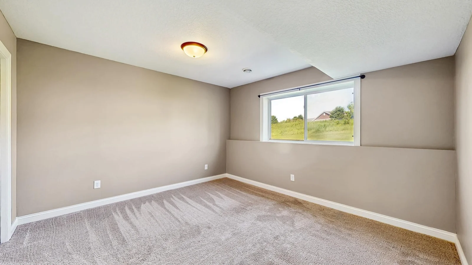 One of two lower level bedrooms.