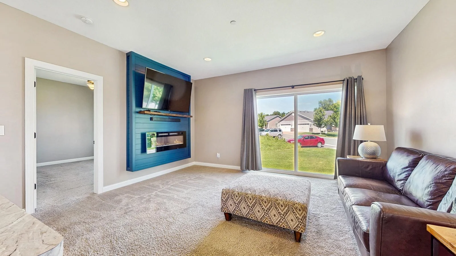 Check out that accent wall and all the natural light pouring in from the patio door!