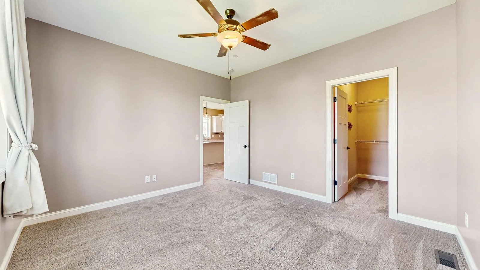 The primary bedroom is located directly off the living room.