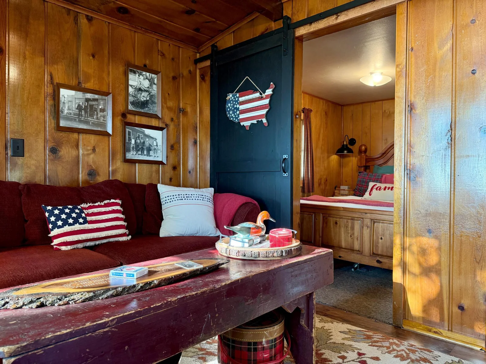 Right off of the living room we have a rustic sliding barn door to enter into our first bedroom.