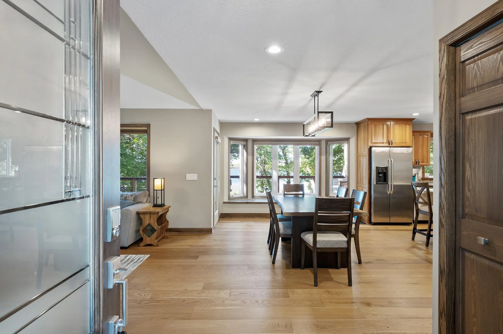 Upon entering, notice the picture windows allowing the light and lake views in!