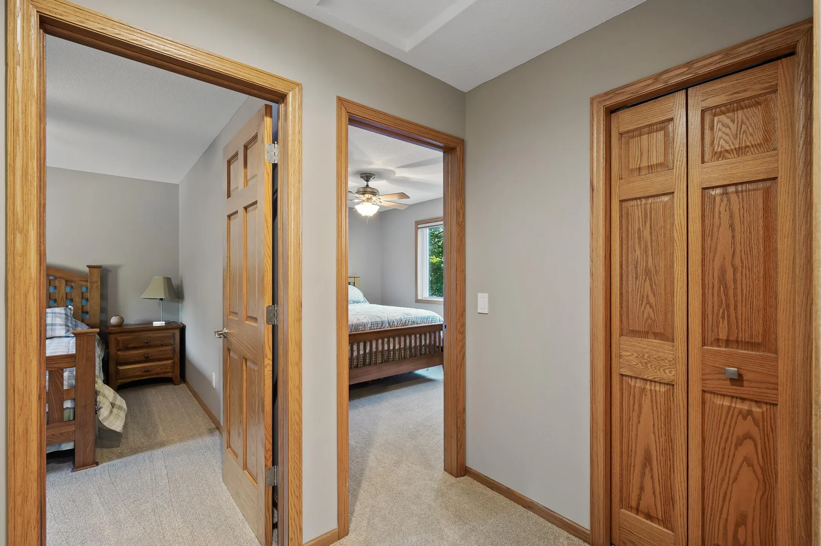 View from hallway to two upper level bedrooms