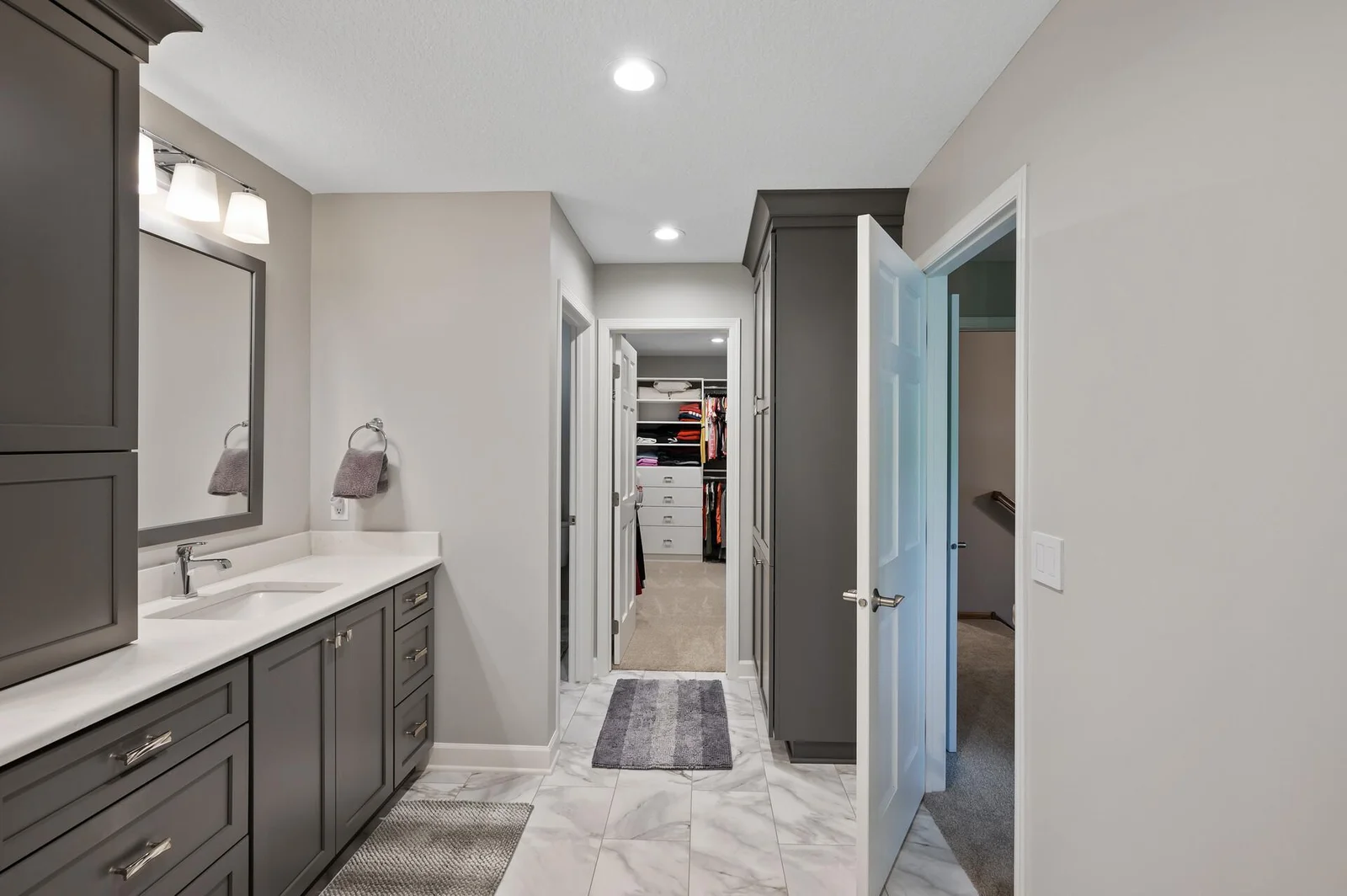 Enter into the primary walk in closet here!