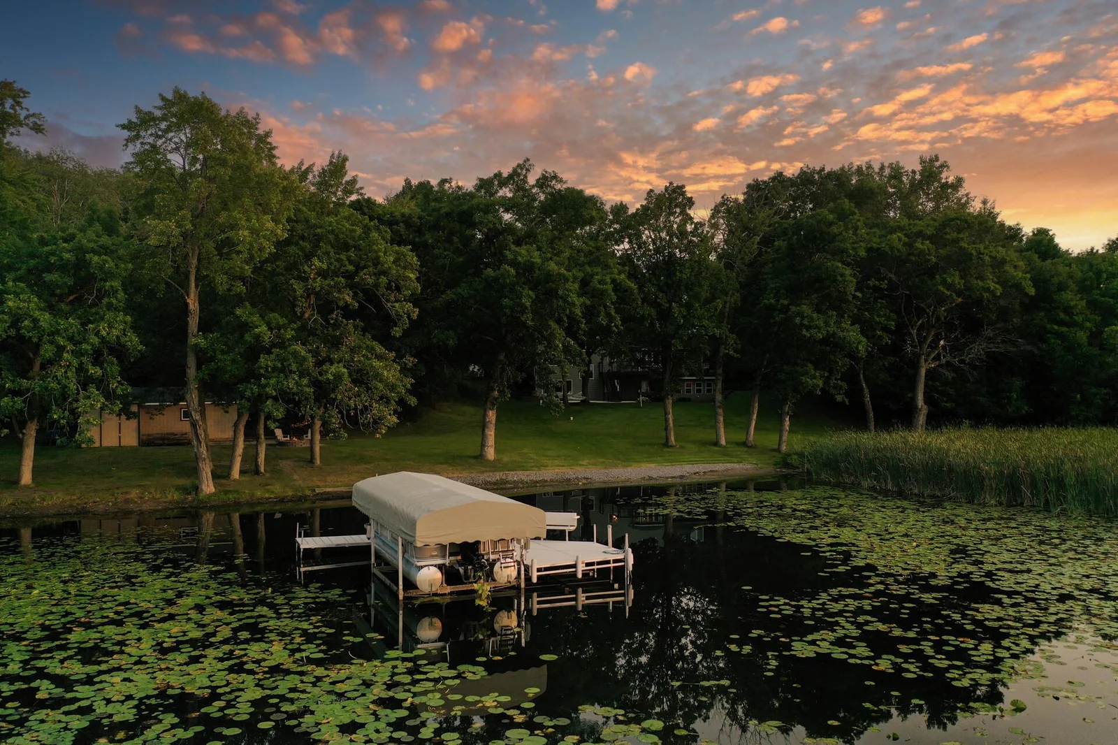 Dusk view of the lakeside of the lot
