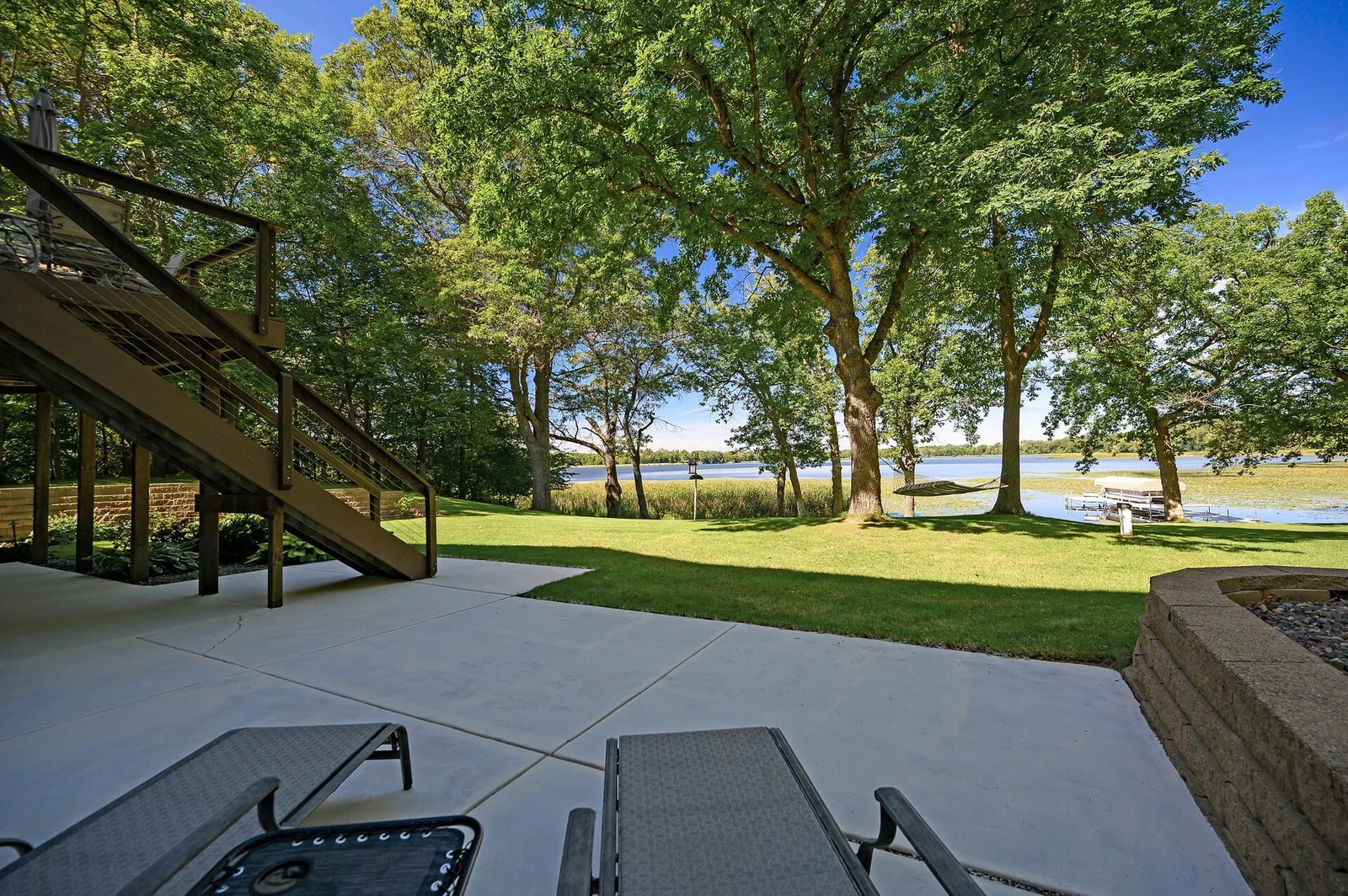 View from the lower level patio of the yard and Kroon Lake.