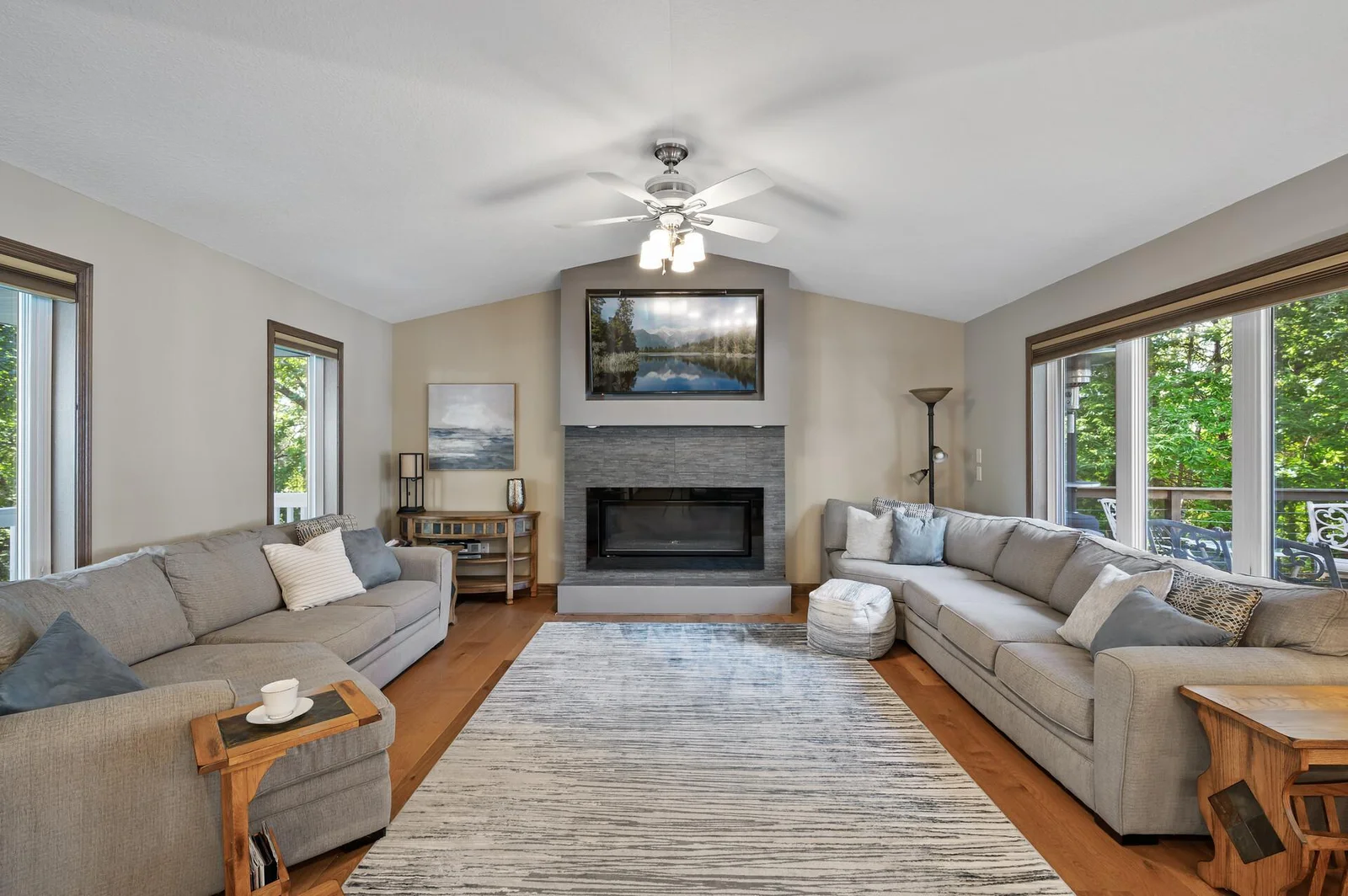 Main level living room with gas fireplace as the focal point.