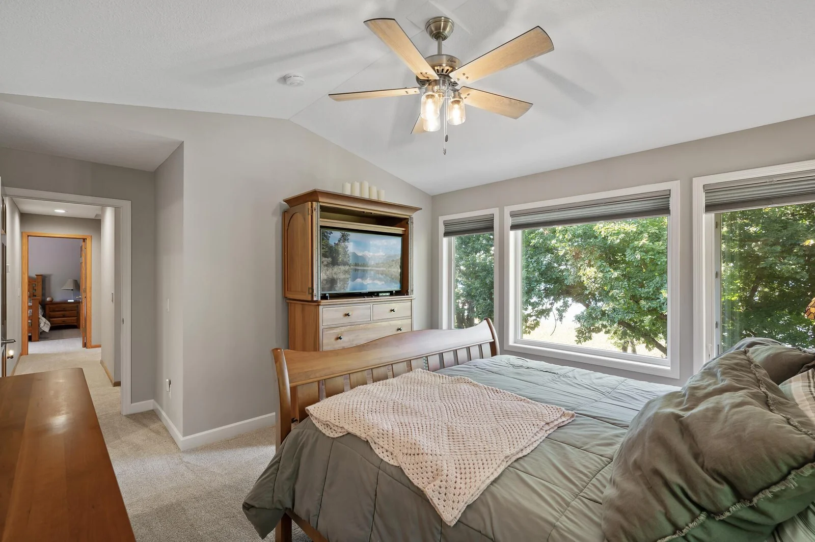 Primary Suite is situated on the opposite side of the upper level from the other bedrooms.