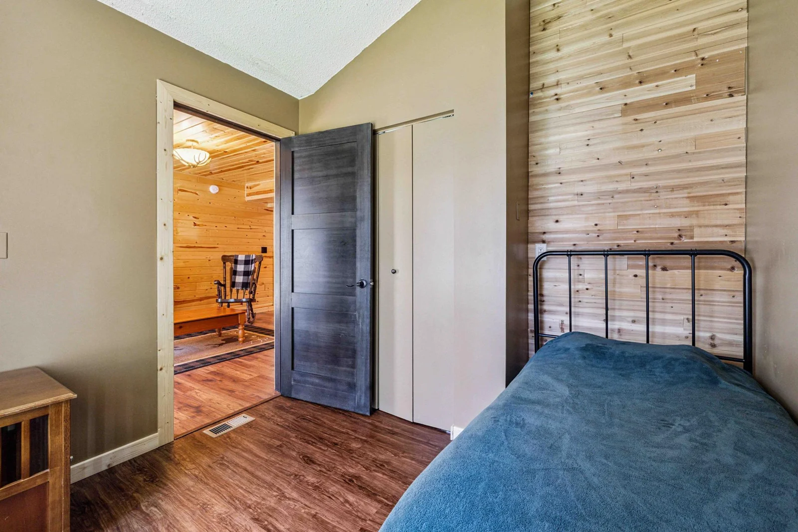 Main level bedroom 2 with bay window views and closet