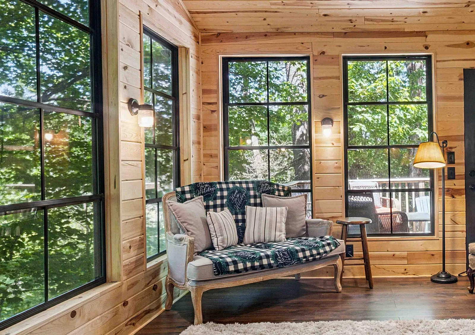 Enclosed porch with EZ Breezy Windows and views to lake
