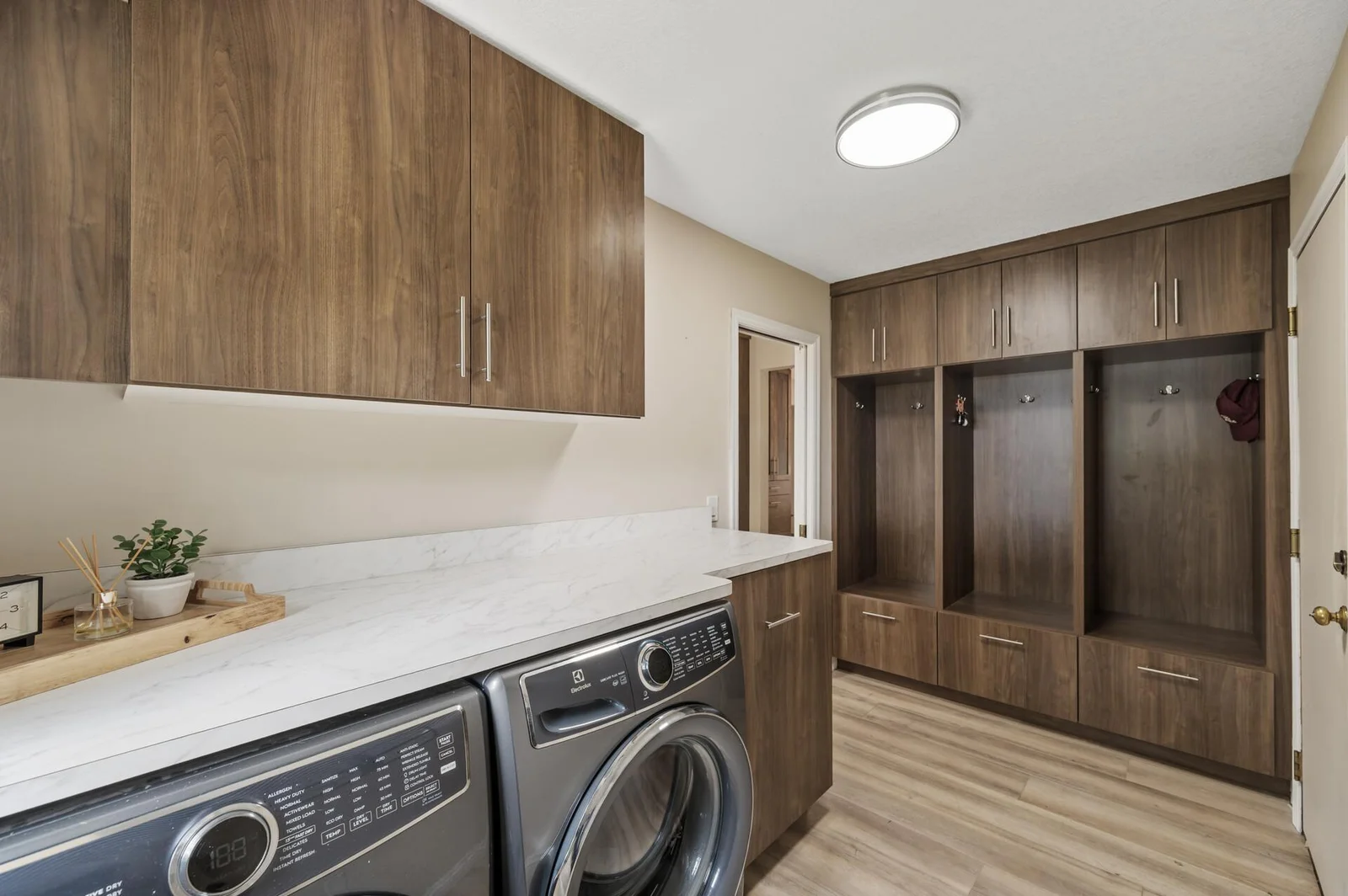 main floor laundry with custom built in lockers