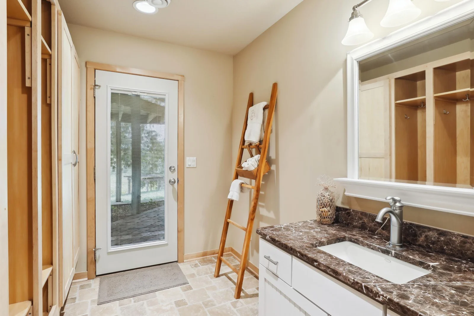 Enjoying the lake and super easy access from outside to the lower level to the bathroom! Thoughtfully planned for endless lake days and memories on the shoreline.