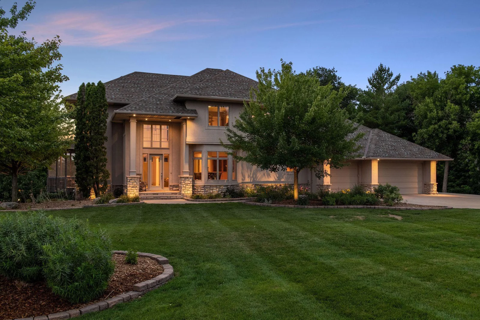Twilight! Welcome to your private oasis on Lake O'Dowd, beautiful mature trees on lakeshore on a fabulous south metro recreational/fishing lake. Absolutely gorgeous curb appeal nestled on a fabulous, .87 acre lakeshore lot!