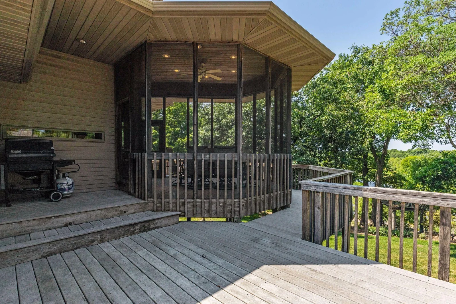 Fabulous platform on deck for grilling time! Large wraparound deck offers a wonderful outdoor setup w/ gorgeous, serene views.