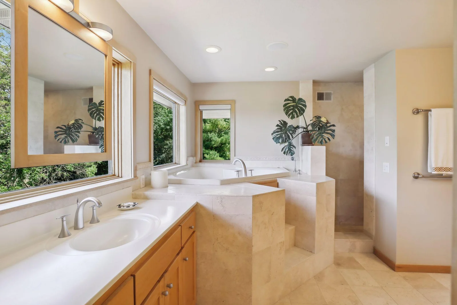 This primary bathroom says relaxation and retreat! Gorgeous tile work, jacuzzi tub and large walk-in shower! Sit back, soak and relax after a long day!