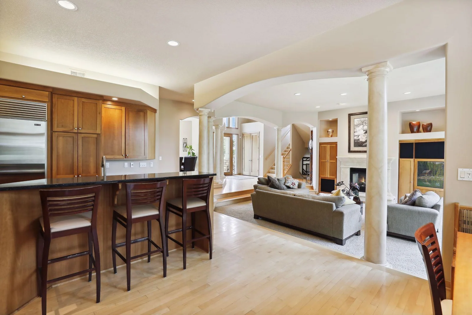 High ceilings w/ welcoming, open floor plan and curved walkways. Large windows throughout make this home light and bright!