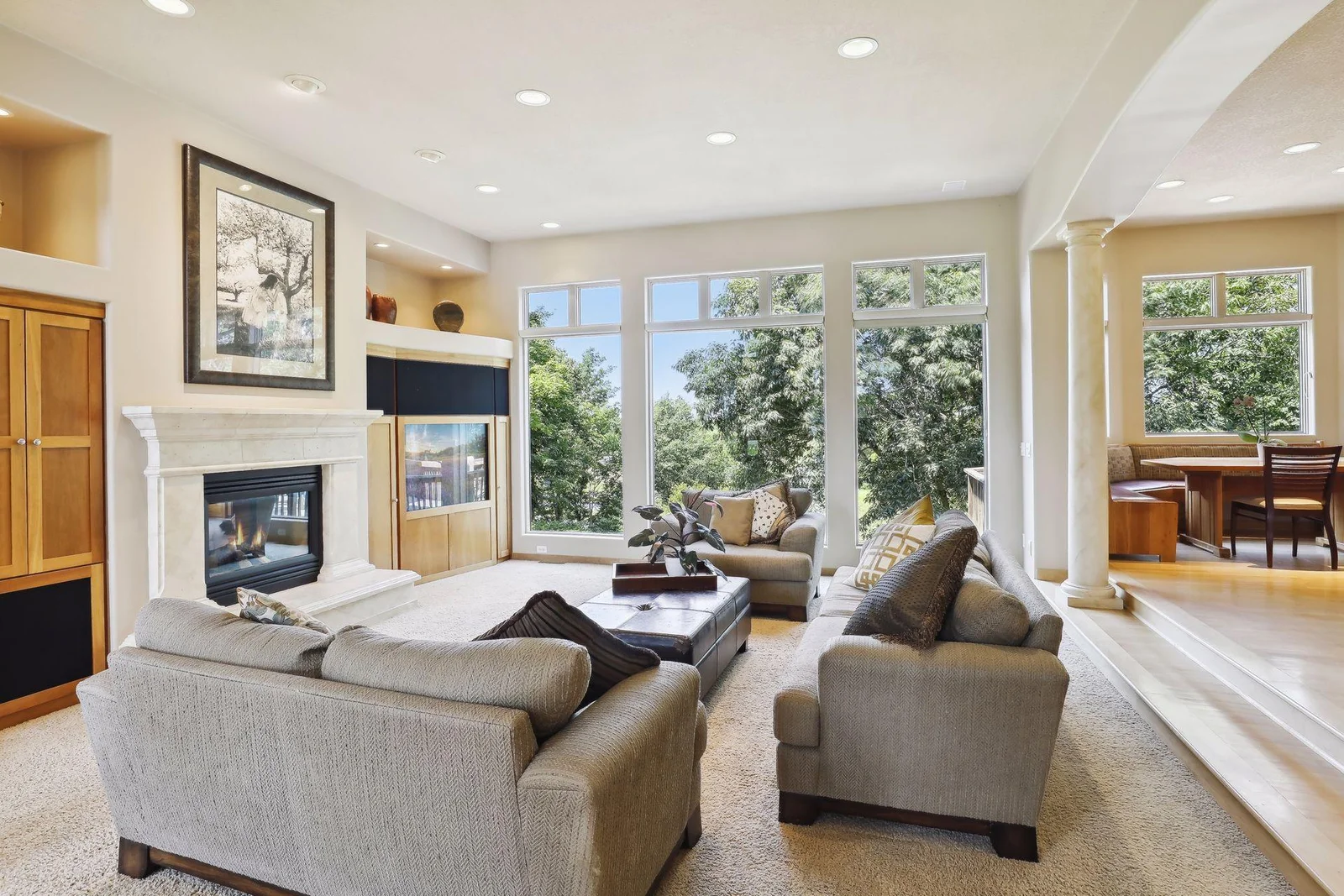 Check out those floor to ceiling windows! Great views from these expansive windows! Stylish but neutral décor throughout. Gorgeous hardwood flooring, neutral carpeting.
