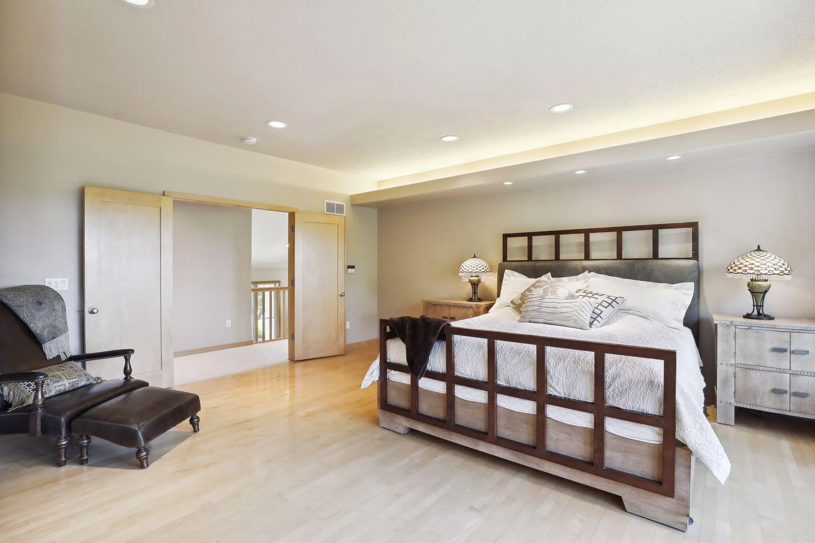 Private, owners sweet features beautiful flooring and  gorgeous, solid wood French doors!