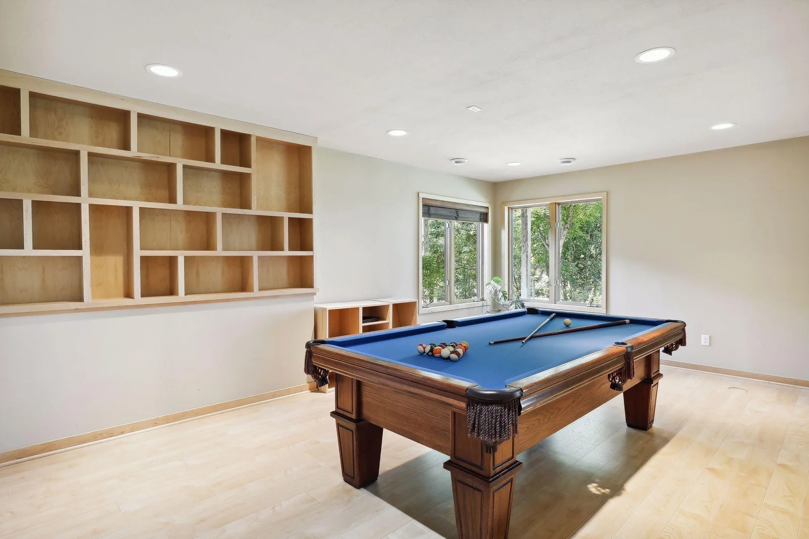 Game on in this fabulous lower level amusement, game room area! Ready for entertaining all! Hardwood floors throughout home is a wonderful upgrade.