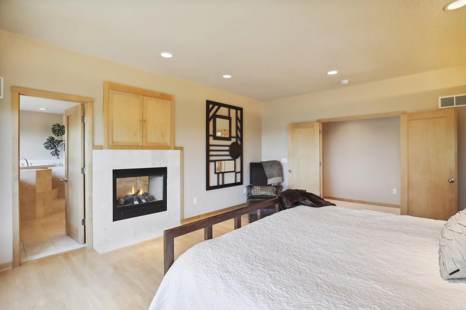 Private, owners sweet features beautiful flooring and  gorgeous, solid wood French doors!