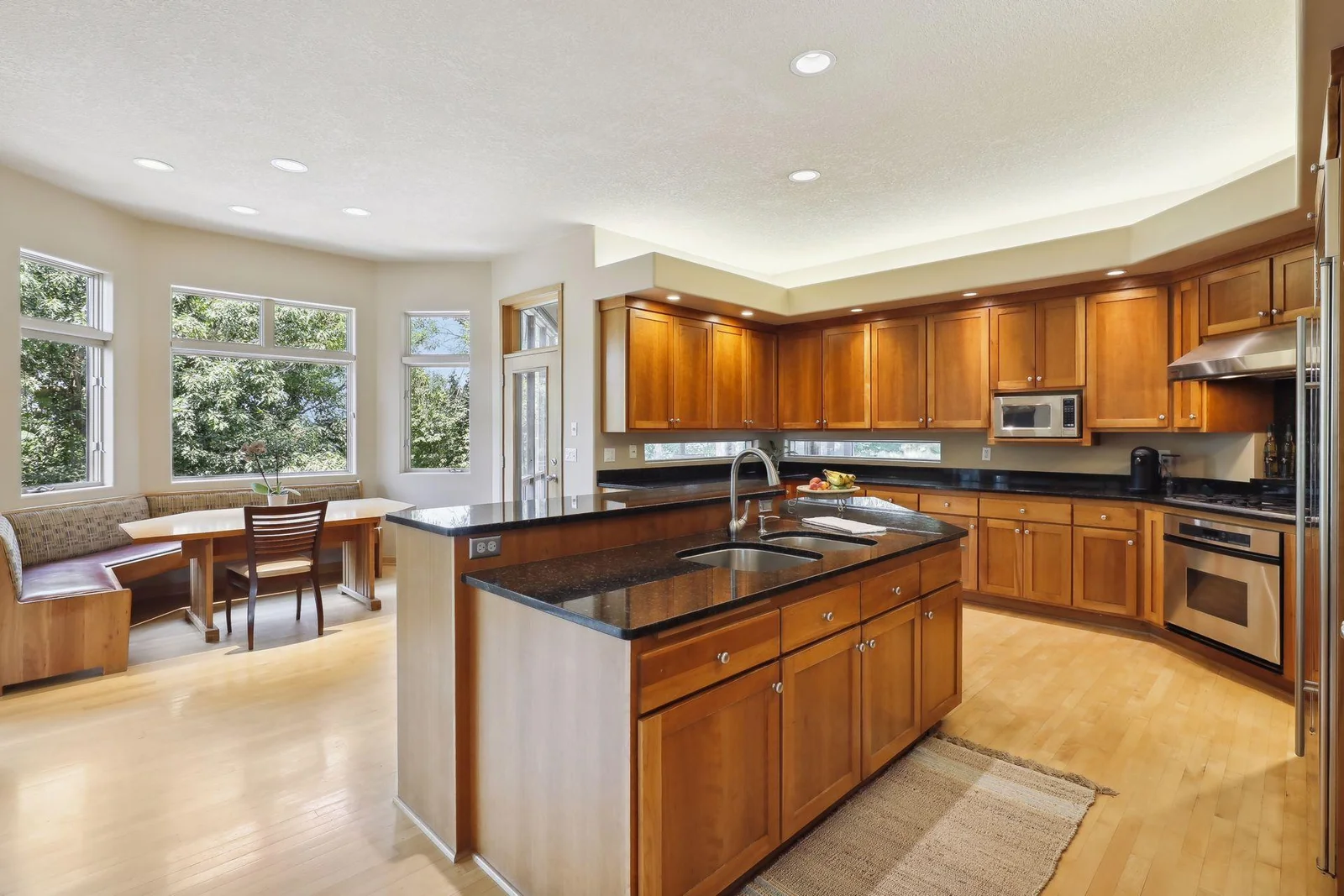 Stunning, modern design! Large center island with sink and breakfast bar. Tons of cabinetry!