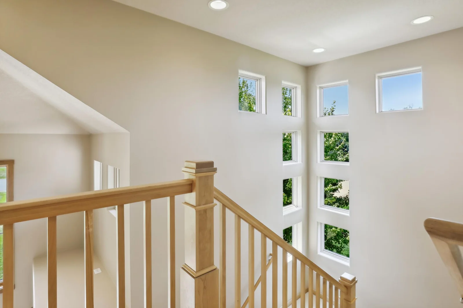 Windows galore! Stunning, modern accents! Stylish window designs bring nature inside making this entire home light, bright and cozy! So warm and welcoming! Gorgeous, natural woodwork throughout!