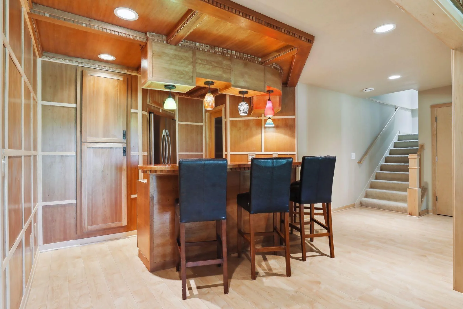 All setup to entertain all year round! Lower level bar is stunning with elegant wood panel design accents, large bar and stunning lights. Absolutely gorgeous and must see in person to appreciate!
