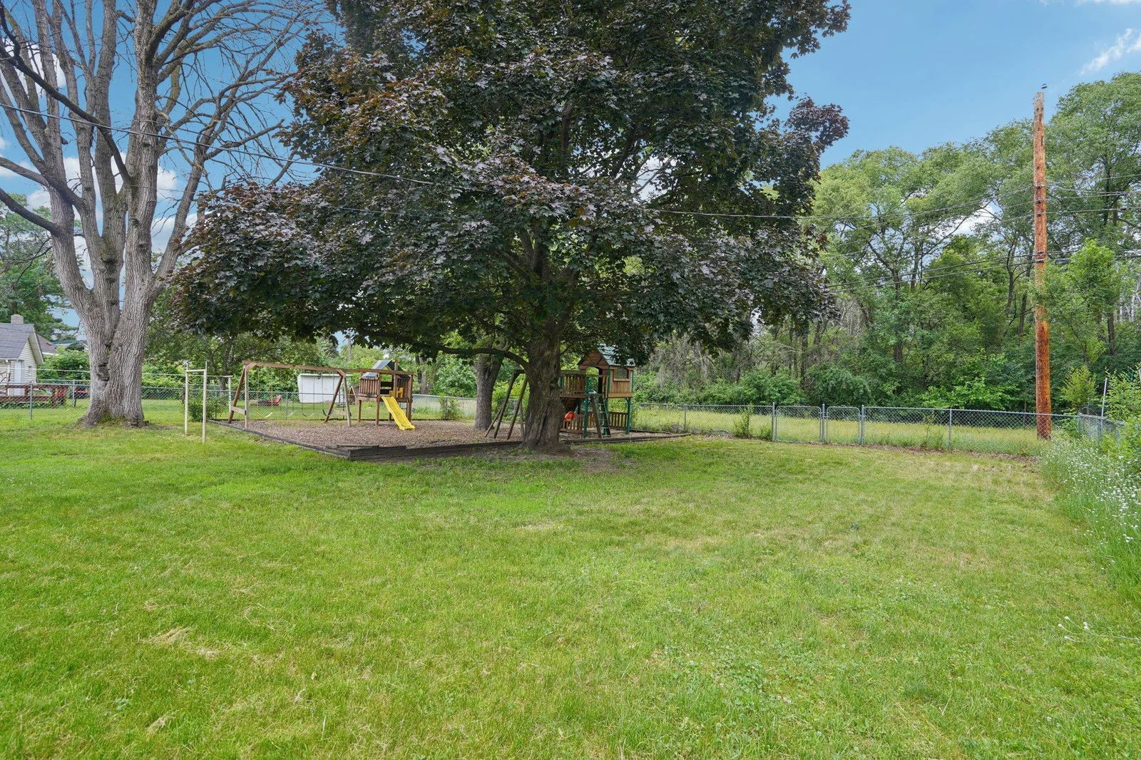 Fully fenced yard with no rear neighbors.