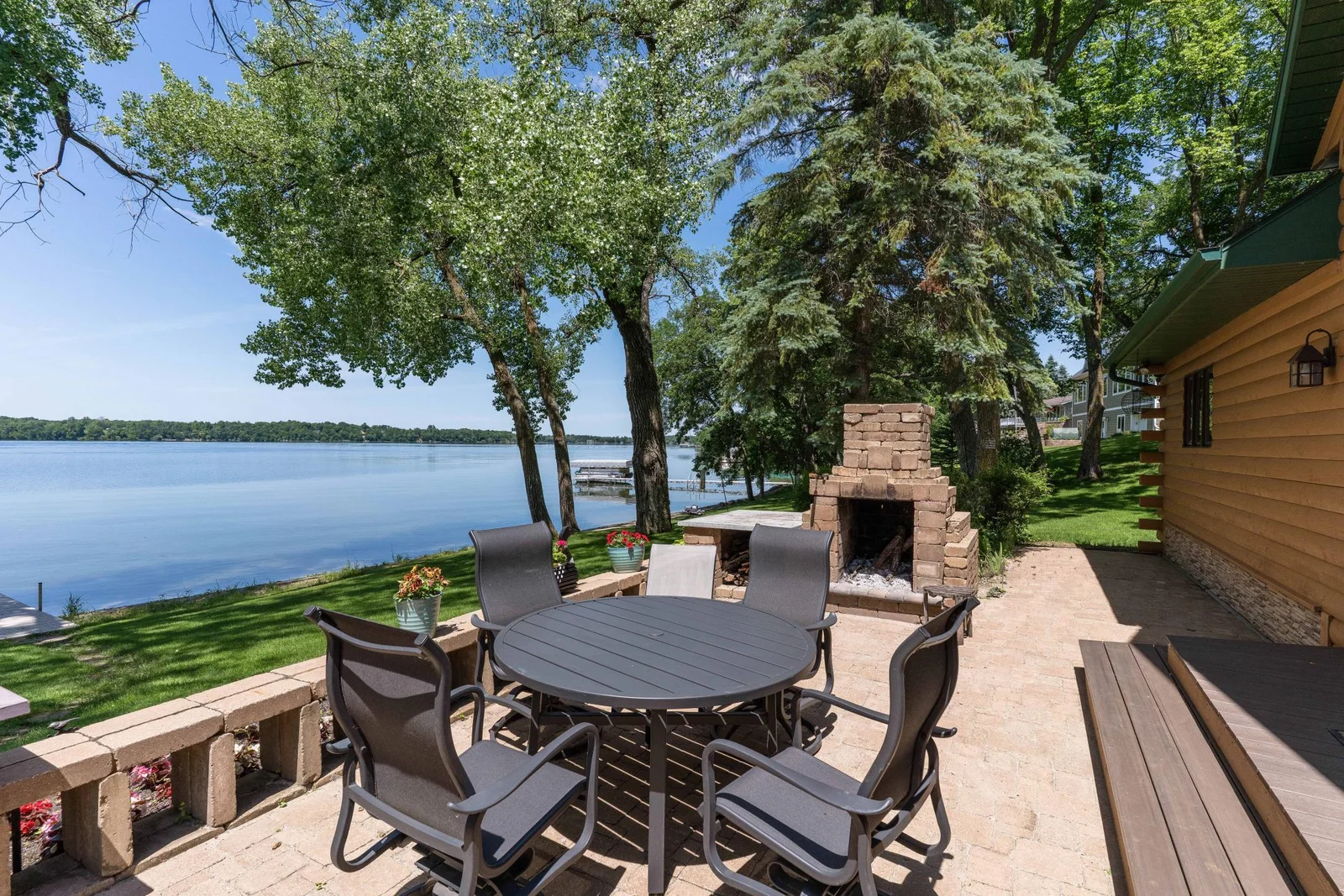 Plenty of room for seating any size family from the Beautiful paver patio. Notice the wood burning fire place
